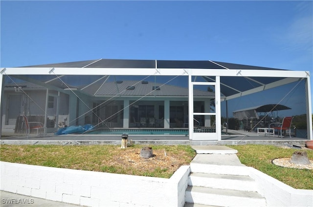 2810 Teal Ct, Saint James City, FL 33956 - rear view of property with a patio, a lanai, and an outdoor pool
