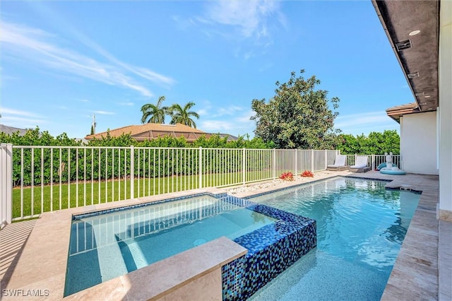 view of swimming pool with a fenced backyard and a pool with connected hot tub