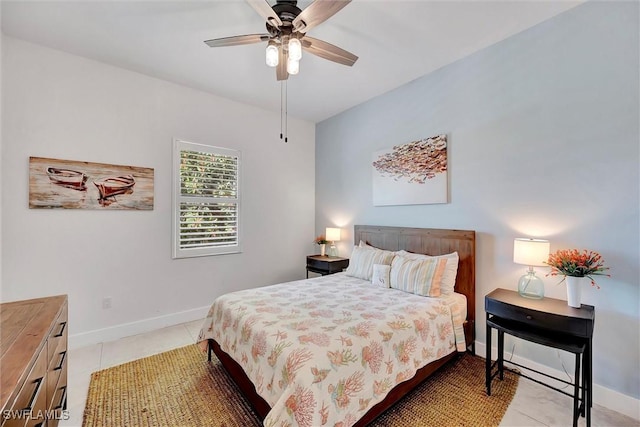 bedroom with light tile patterned floors, baseboards, and a ceiling fan