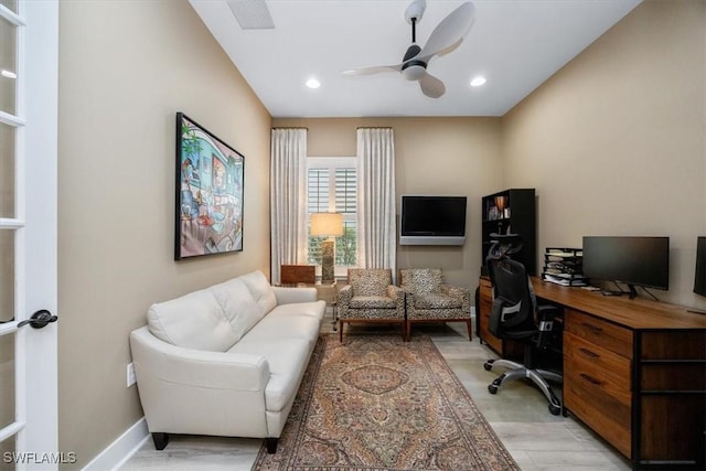 office space with light wood-type flooring, visible vents, a ceiling fan, recessed lighting, and baseboards