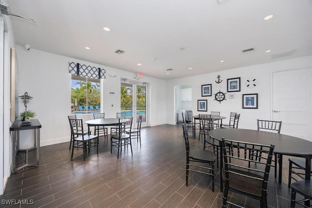 dining room with wood finish floors, visible vents, and recessed lighting