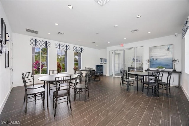 dining area with visible vents, recessed lighting, baseboards, and wood finish floors