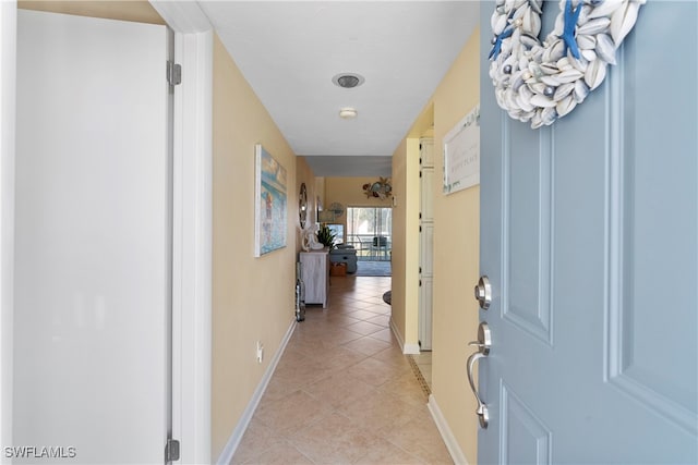 755 Village Cir Unit 203, Venice, FL 34292 - hallway with light tile patterned flooring and baseboards