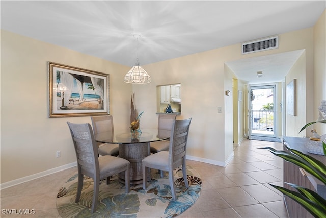 755 Village Cir Unit 203, Venice, FL 34292 - dining room with light tile patterned flooring, visible vents, and baseboards