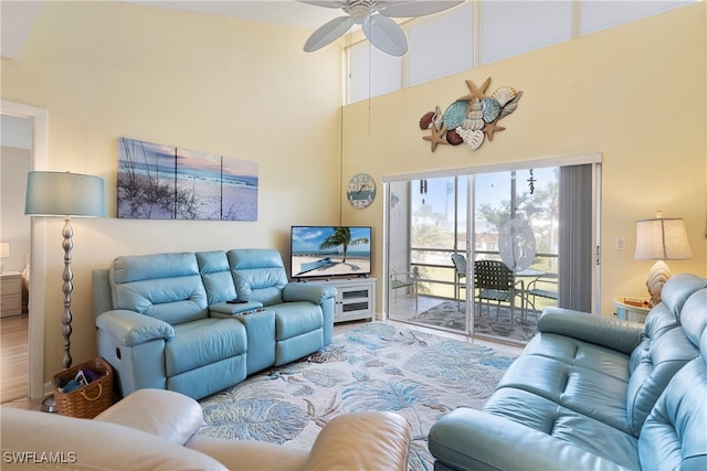 755 Village Cir Unit 203, Venice, FL 34292 - living area featuring a high ceiling, a ceiling fan, and wood finished floors