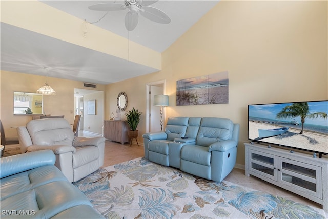 755 Village Cir Unit 203, Venice, FL 34292 - living room featuring a ceiling fan, visible vents, baseboards, lofted ceiling, and tile patterned flooring