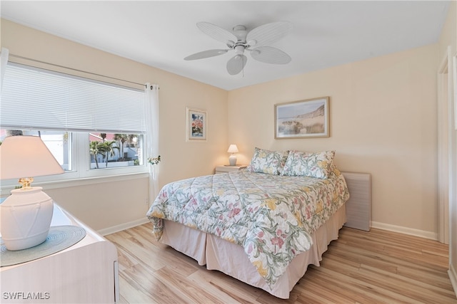 755 Village Cir Unit 203, Venice, FL 34292 - bedroom featuring light wood-style flooring, baseboards, and ceiling fan