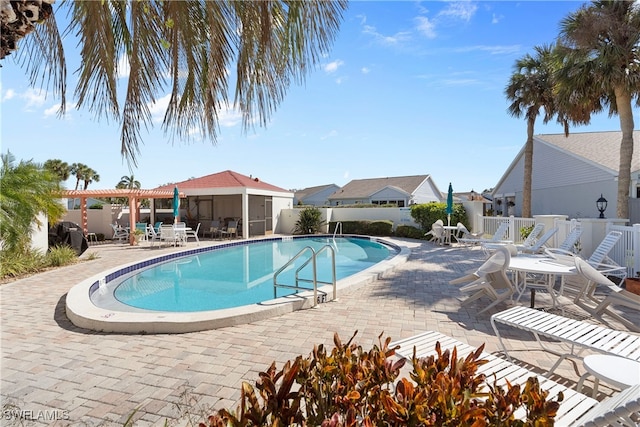 755 Village Cir Unit 203, Venice, FL 34292 - pool with a pergola, a patio area, and fence