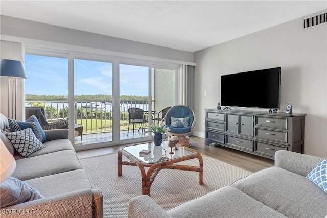 309 Goodlette-Frank Rd S Unit A305, Naples, FL 34102 - living area with wood finished floors and a water view