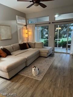 12713 Devonshire Lakes Dr, Fort Myers, FL 33913 - living area with wood finished floors and ceiling fan