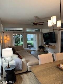 12713 Devonshire Lakes Dr, Fort Myers, FL 33913 - living area featuring wood finished floors and ceiling fan