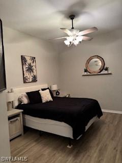 12713 Devonshire Lakes Dr, Fort Myers, FL 33913 - bedroom with baseboards, wood finished floors, and a ceiling fan