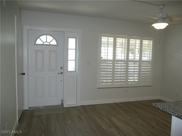 entrance foyer featuring a ceiling fan, wood finished floors, and baseboards