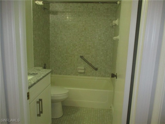 bathroom with tile patterned floors, toilet, bathtub / shower combination, and vanity