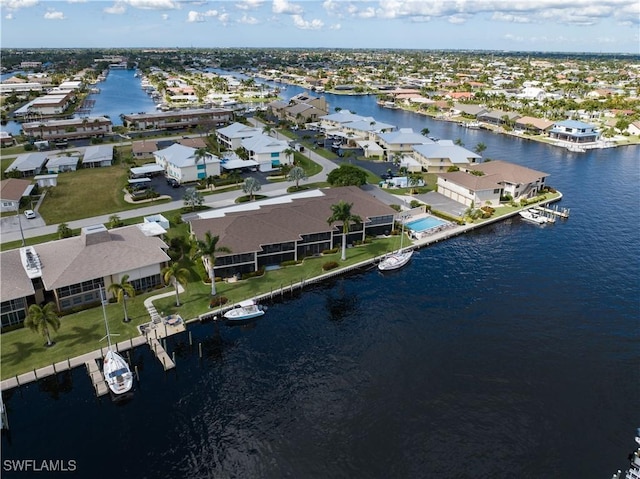 aerial view with a residential view and a water view