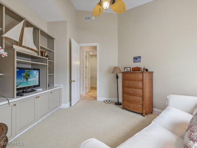265 Colonade Cir, Naples, FL 34103 - living room featuring ceiling fan, visible vents, baseboards, and light carpet