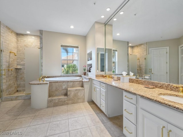 265 Colonade Cir, Naples, FL 34103 - bathroom featuring a shower stall, a bath, double vanity, and a sink