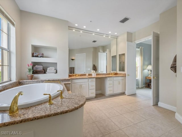 265 Colonade Cir, Naples, FL 34103 - bathroom with visible vents, a garden tub, recessed lighting, tile patterned floors, and vanity
