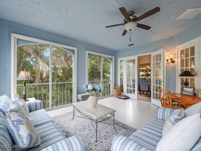 265 Colonade Cir, Naples, FL 34103 - living room with tile patterned flooring, a ceiling fan, visible vents, and a textured ceiling