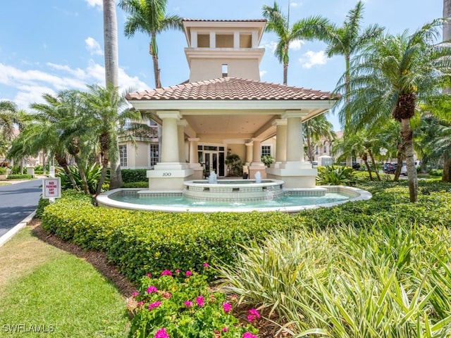 265 Colonade Cir, Naples, FL 34103 - back of property featuring a tiled roof and stucco siding