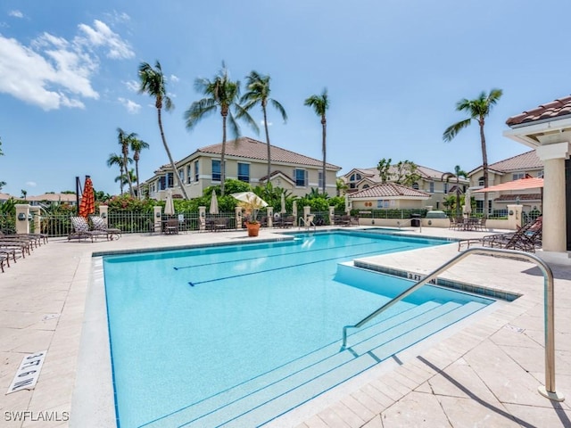265 Colonade Cir, Naples, FL 34103 - pool featuring a patio, fence, and a residential view