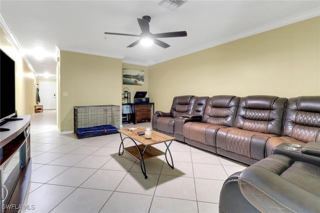 living room with visible vents, crown molding, baseboards, light tile patterned flooring, and a ceiling fan