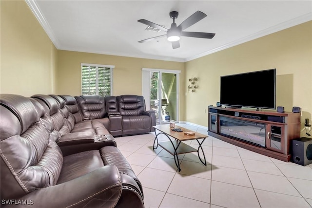 tiled living room featuring visible vents, baseboards, ceiling fan, and crown molding