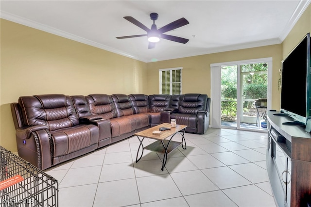 living room with light tile patterned flooring, ornamental molding, and a ceiling fan