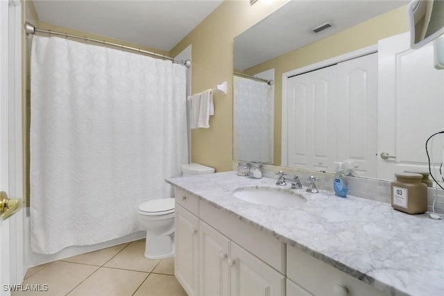 full bath with vanity, a shower with curtain, visible vents, tile patterned floors, and toilet