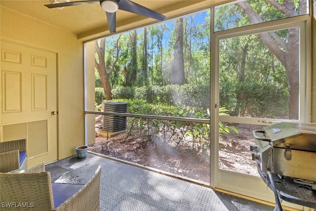 sunroom featuring a wealth of natural light and ceiling fan