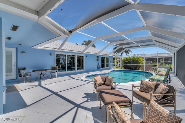 outdoor pool with a patio and a lanai