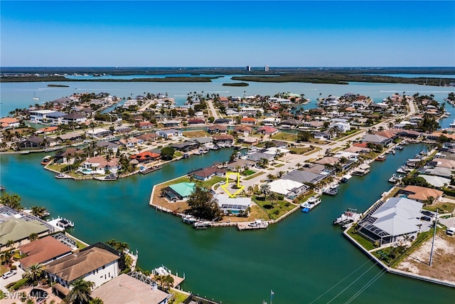 drone / aerial view featuring a water view and a residential view