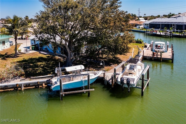 dock area featuring a water view and boat lift