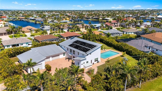 bird's eye view featuring a residential view and a water view
