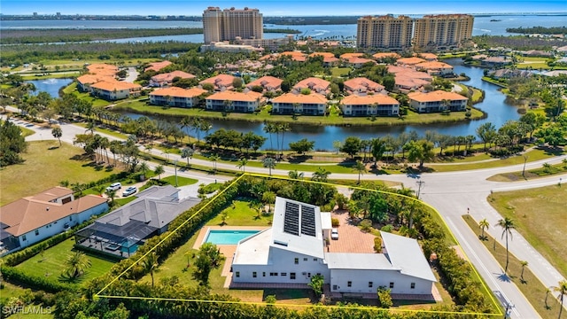 birds eye view of property with a water view