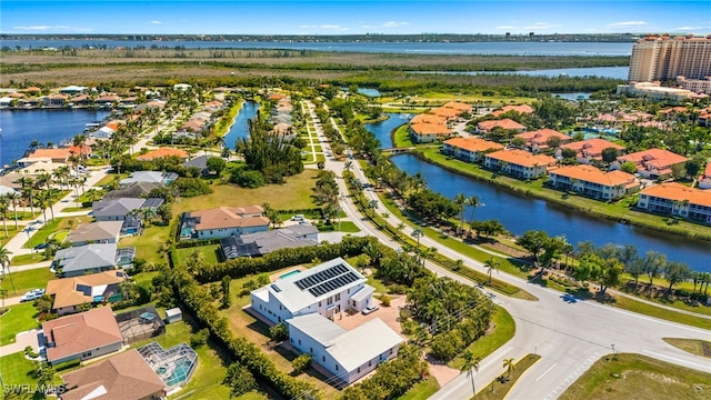 aerial view with a residential view and a water view