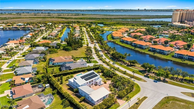 bird's eye view featuring a residential view and a water view