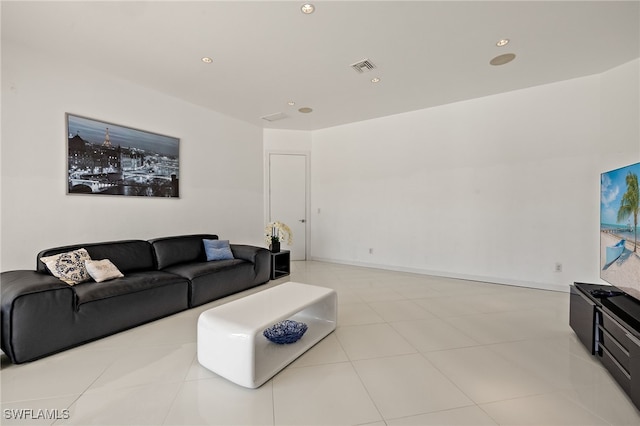 living room featuring light tile patterned floors, recessed lighting, visible vents, and baseboards