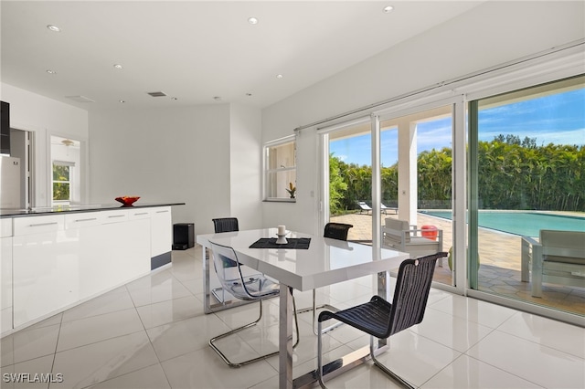 dining area with light tile patterned flooring, recessed lighting, and visible vents