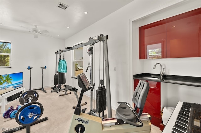 exercise room with visible vents, light carpet, a sink, recessed lighting, and ceiling fan