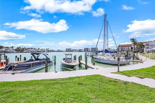 view of dock featuring a yard and a water view