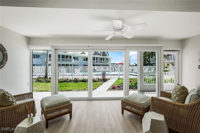 sunroom / solarium with ceiling fan