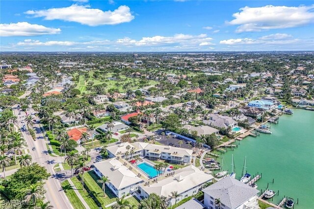 drone / aerial view with a residential view and a water view