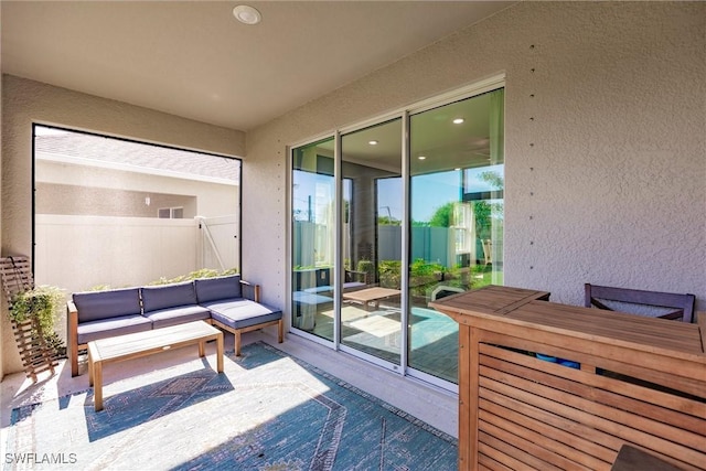 exterior space with an outdoor hangout area and a patio area