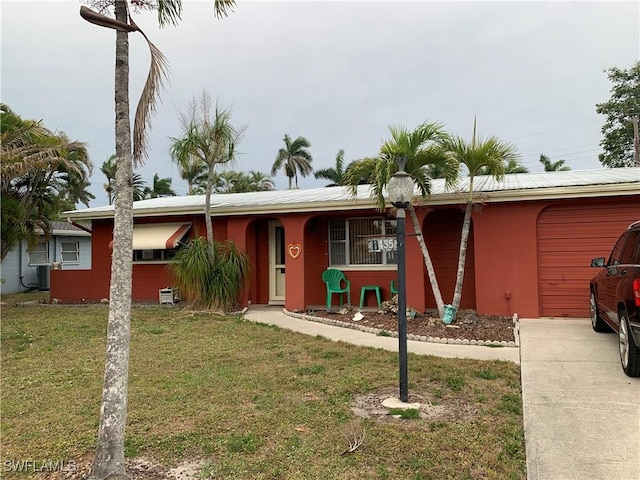 ranch-style home with a front lawn