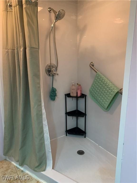 full bath with a shower stall