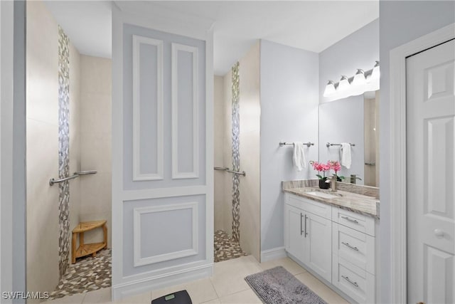 full bath featuring vanity, tile patterned floors, and a walk in shower