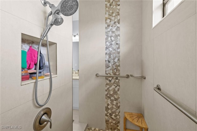 bathroom with tiled shower