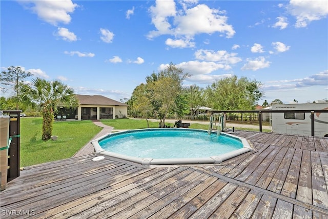 pool with a deck and a lawn