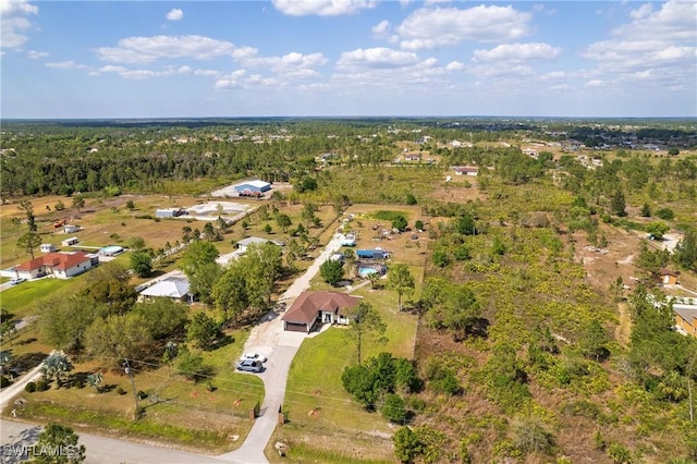 aerial view featuring a wooded view